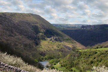 Fin Cop Hill overlooks the River Wye as it winds through Monsal Dale.