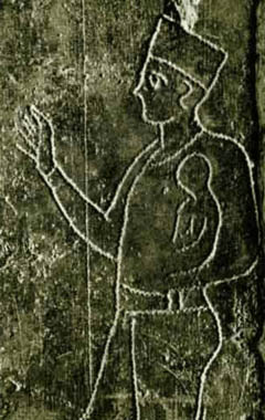 A stele showing a Carthaginian priest holding an infant. The priest is usually interpreted as preparing to the sacrifice the infant.