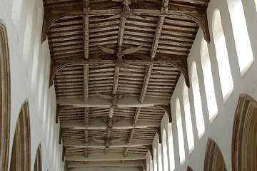The carved wooden angels on the ceiling of Blythburgh church in Suffolk were damaged by Cromwell's iconoclastic Puritan soldiers.