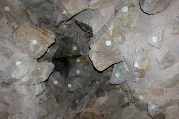 Metal anchors in the ceiling stones