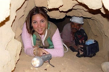 Kathleen Martinez explores a tomb.