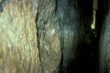 The hole in the wall of Hezekiah's Tunnel from which the Siloam Inscription was hacked. The exit from the tunnel can be seen in the background.